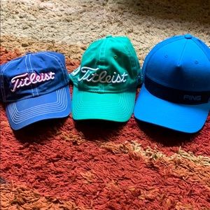 Two Titleist and one Ping hat